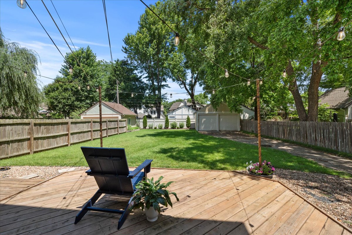 Large fully fenced backyard viewed from the deck